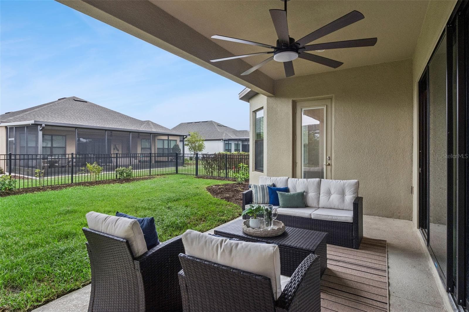 Covered patio lounge area to enjoy Central Florida's year round sunshine. - 4108 VIA TOLEDO CT, POINCIANA