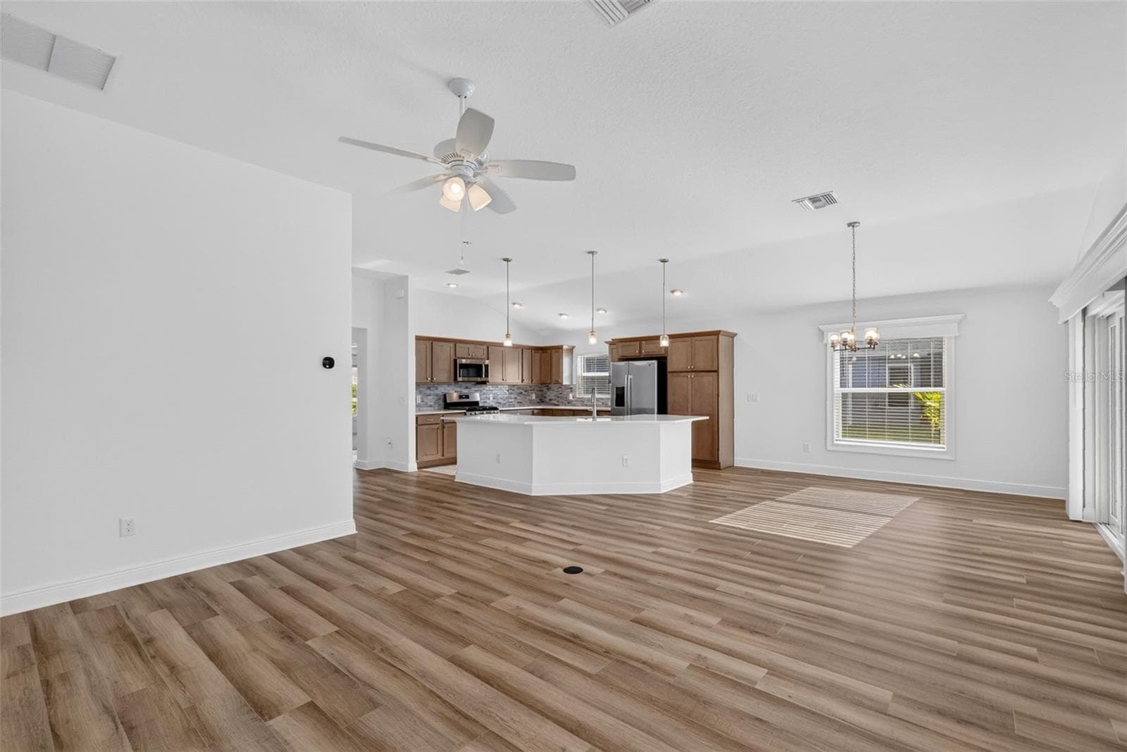 Living, Dining, and Kitchen - 6996 DWIGHT DR, THE VILLAGES