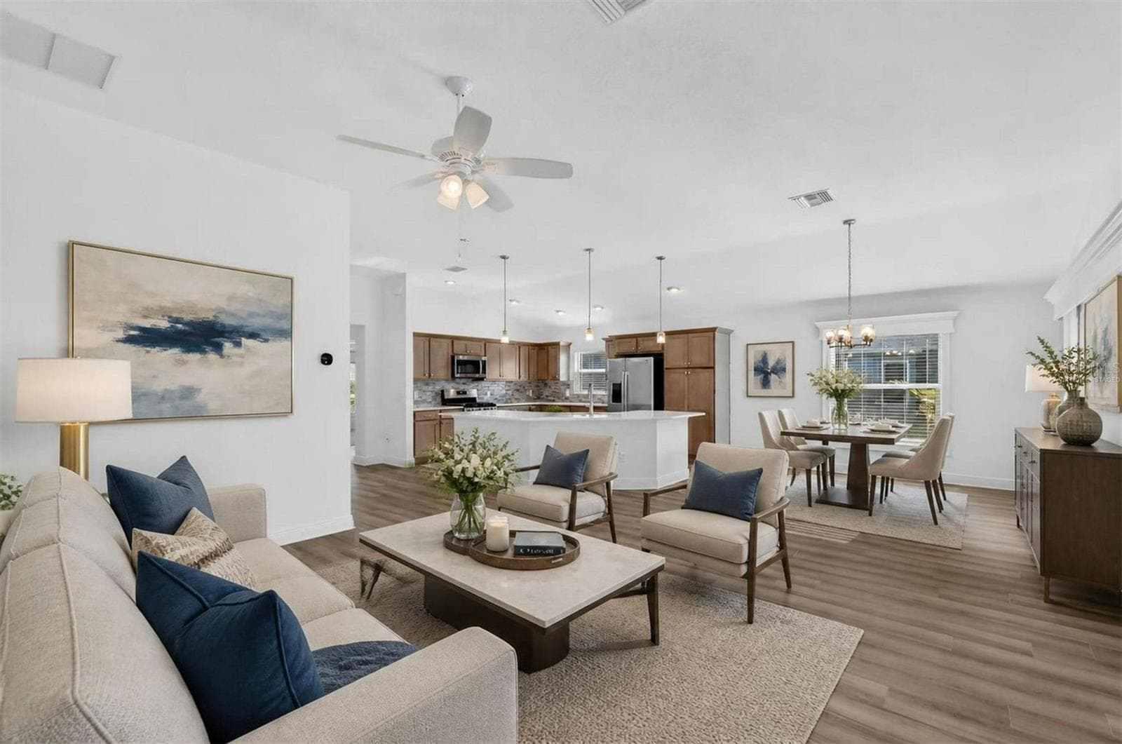 Living, Dining, and Kitchen-Virtually Staged - 6996 DWIGHT DR, THE VILLAGES