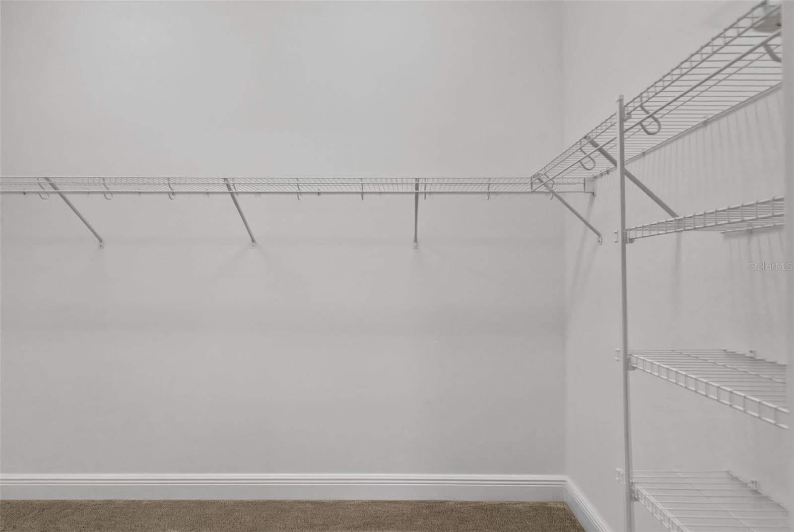 Primary Bedroom Walk-In Closet - 6996 DWIGHT DR, THE VILLAGES