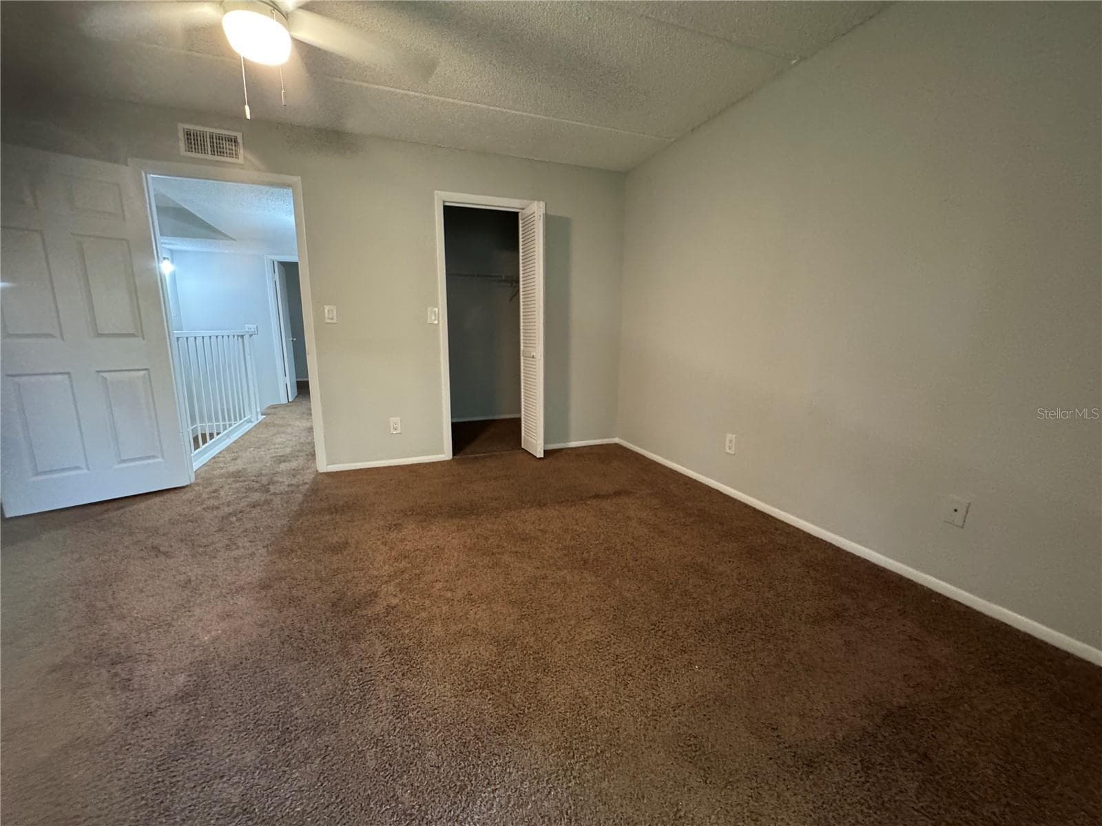 PRIMARY ROOM LOOKING FROM BALCONY TO WALK IN CLOSET - 2884 SOMERSET PARK DR #2907, TAMPA