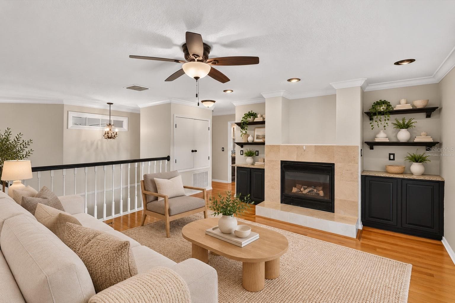 Virtually staged: Alternate view of the loft and fireplace. - 2109 WEMBLEY PL, OVIEDO