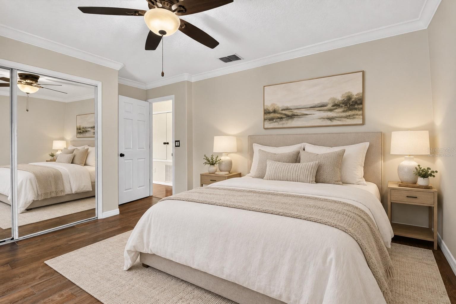 Virtually staged: Bedroom with wood flooring and an adjoining bathroom. - 2109 WEMBLEY PL, OVIEDO