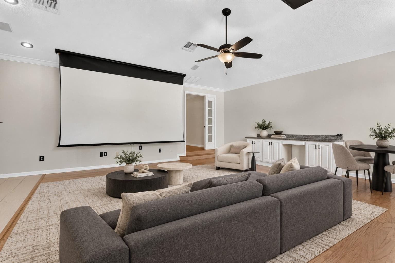 Virtually staged: Bonus room illustrated as a home theater and lounge. - 2109 WEMBLEY PL, OVIEDO
