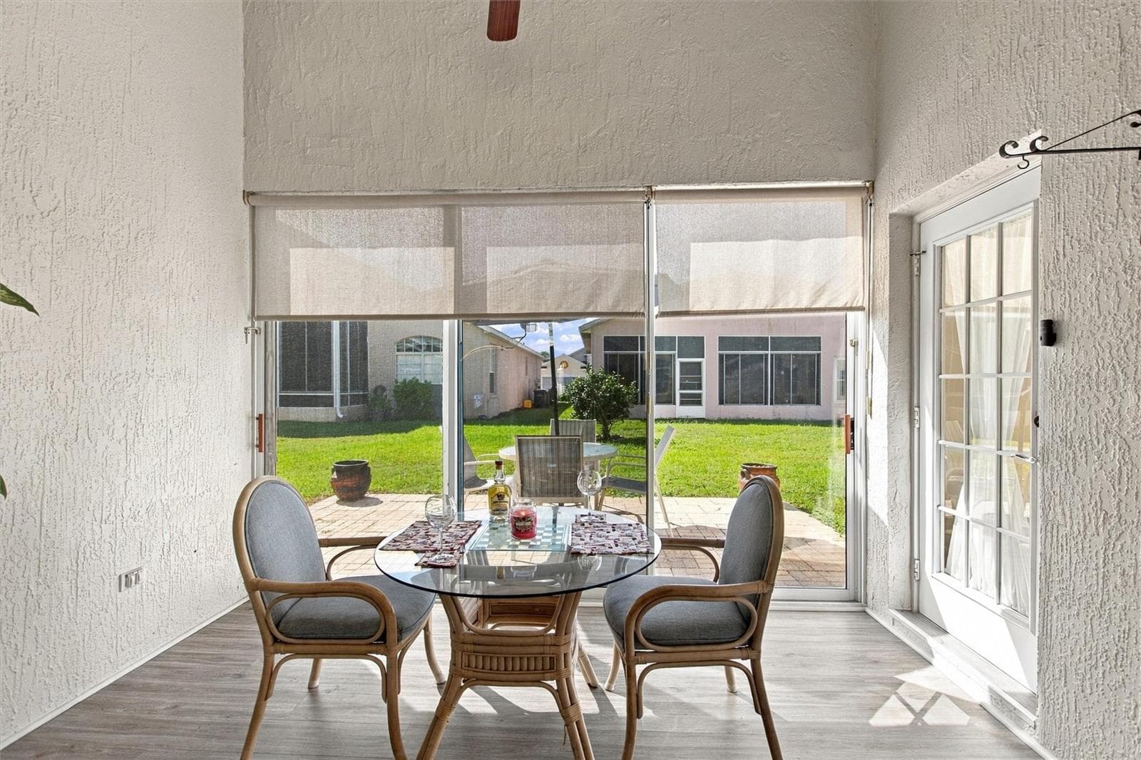 Florida room opens to a brick paver open-air patio - 217 FLEMING LN, DAVENPORT