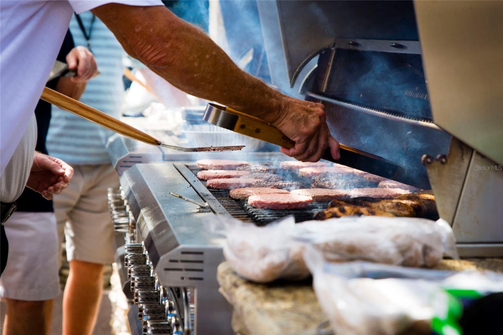 One of many community get togethers at the outdoor kitchen - 217 FLEMING LN, DAVENPORT