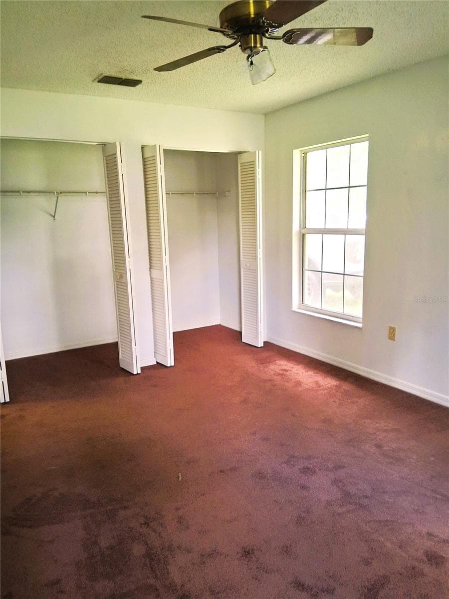 Primary bedroom closet space - 21617 SW PEACH BLOSSOM ST, DUNNELLON