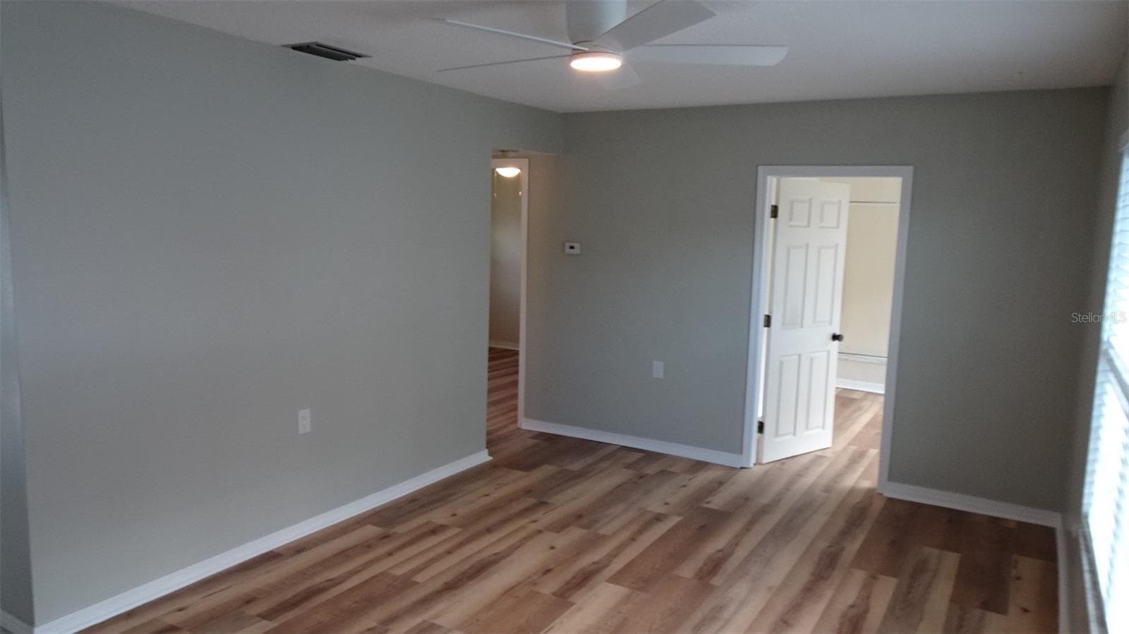 White door leads into front den/office - 7809 38TH TER N, ST PETERSBURG