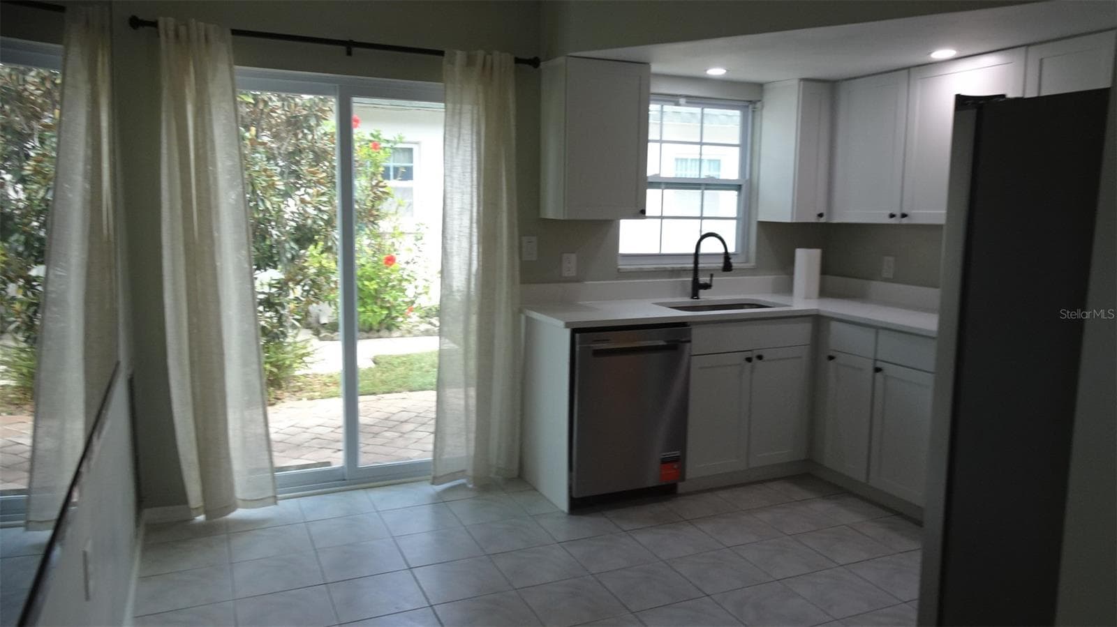 Eat in Kitchen. All new cabinets, counter top and Stainless appliances. - 7809 38TH TER N, ST PETERSBURG