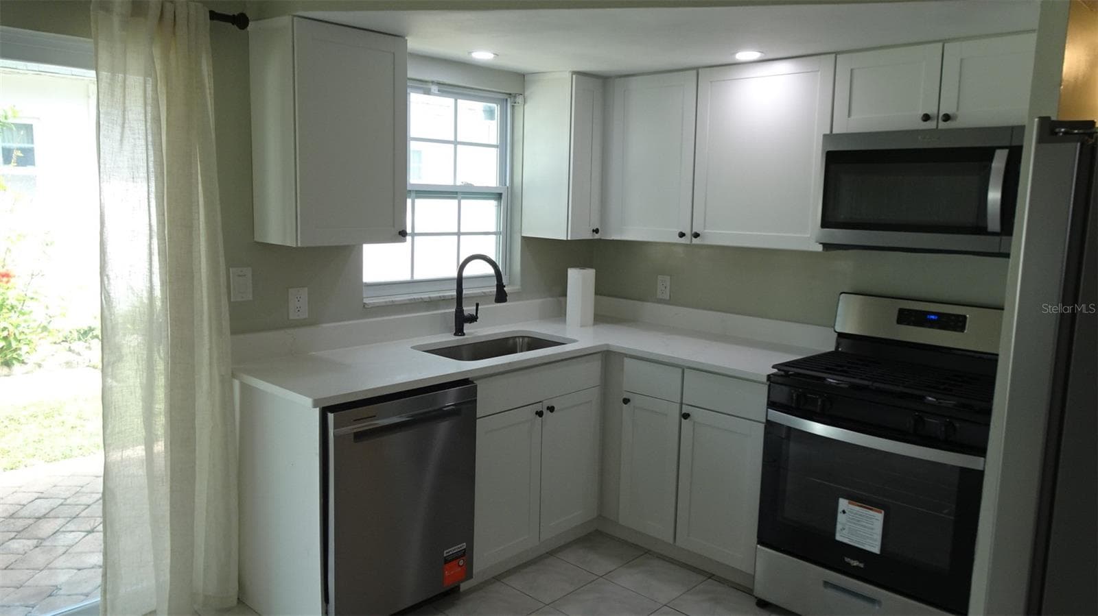 Natural light from the north facing window and door. - 7809 38TH TER N, ST PETERSBURG