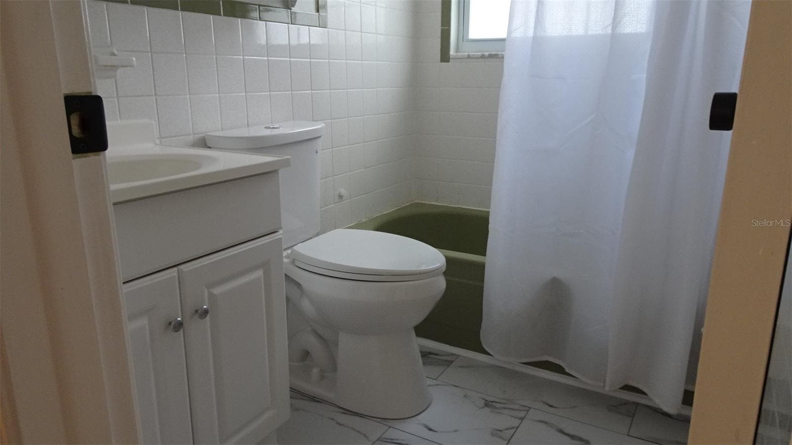 Vanity and toilet recent updates - 7809 38TH TER N, ST PETERSBURG