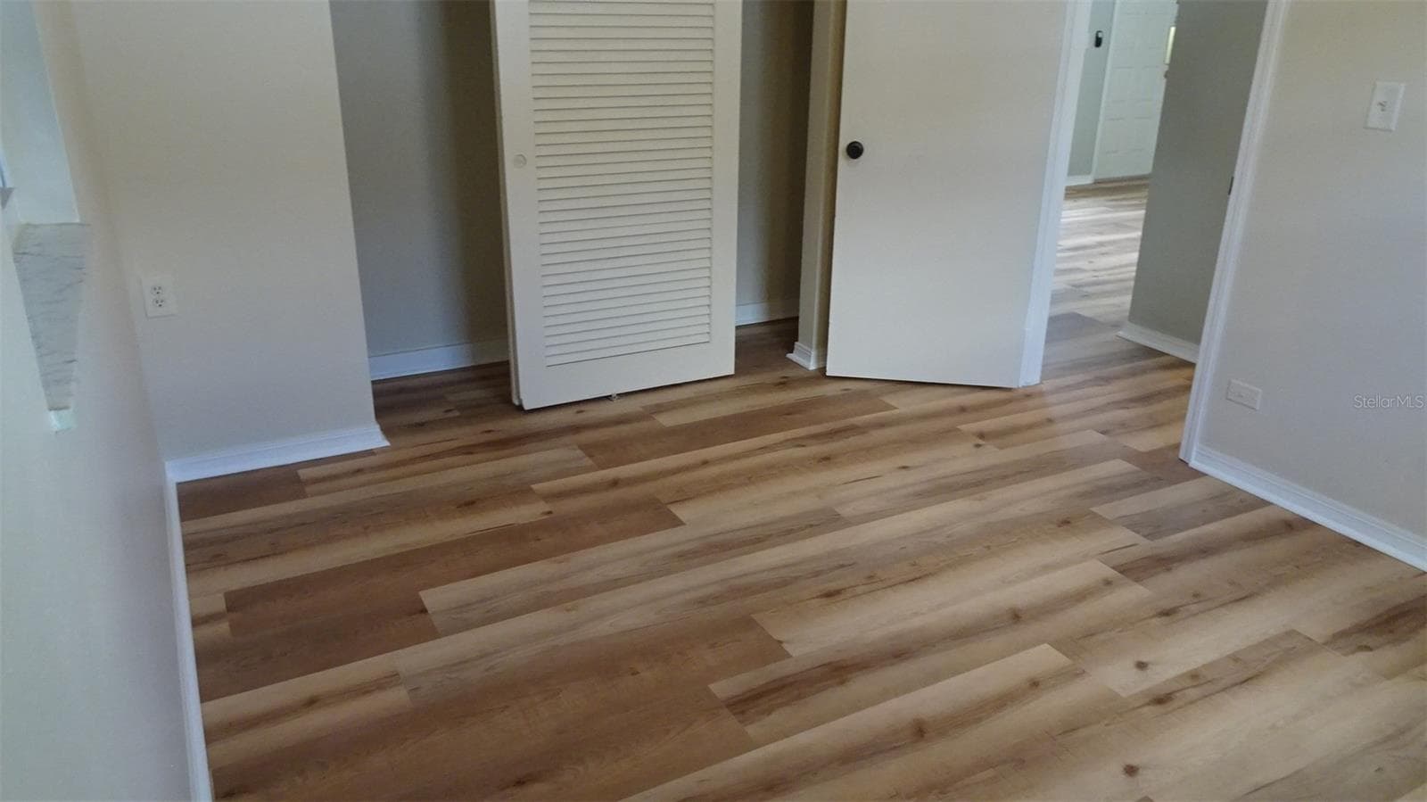 Nice floors! Primary bedroom, wooded closet doors, not the old metal. - 7809 38TH TER N, ST PETERSBURG