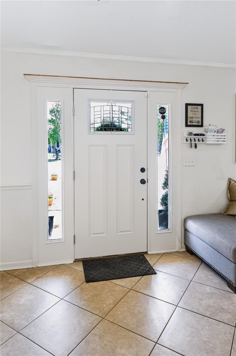 FRONT DOOR WITH GLASS INSERT AND DOUBLE SIDELIGHTS - 2280 HAGEN AVE, DELTONA