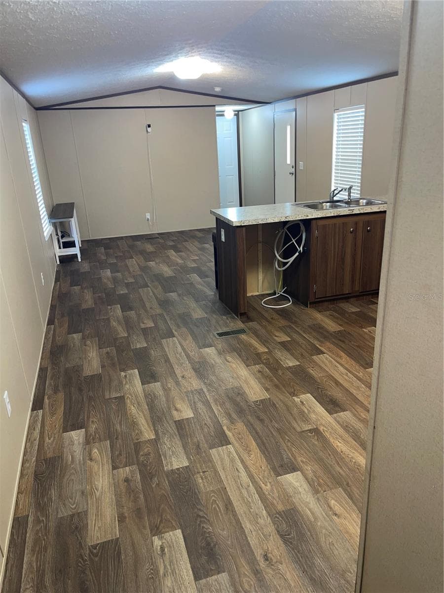 Back door view into kitchen and living room - 7231 NW 28TH LN, CHIEFLAND