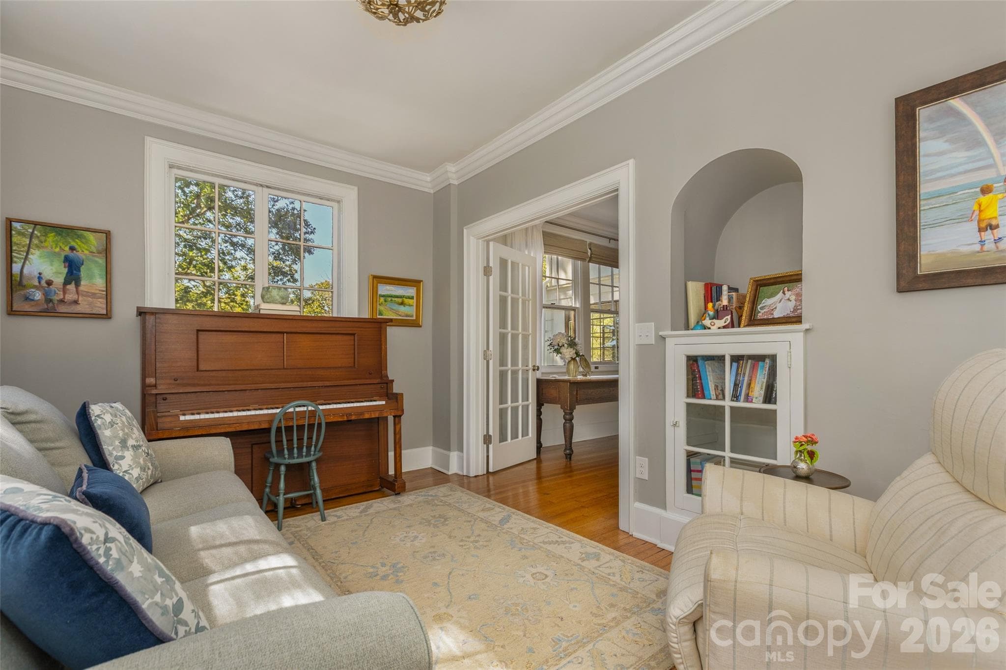 Sitting room with original custom built in. - 200 Kimberly Avenue, Asheville