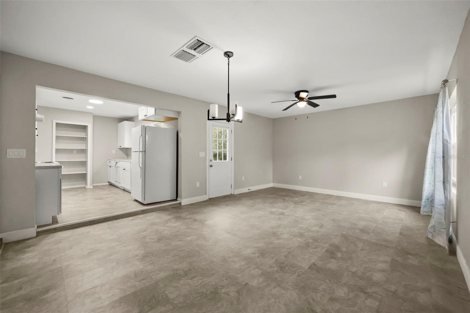Living and dining room area right off the kitchen - 2410 ORANGE AVE, SANFORD