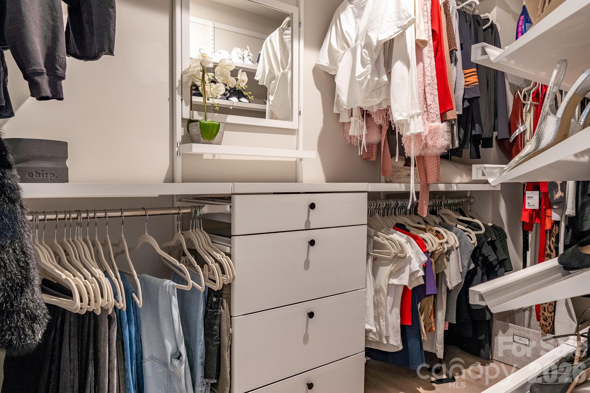 Primary bedroom closet with custom builtin for organization - 9238 Northfield Crossing Drive, Charlotte