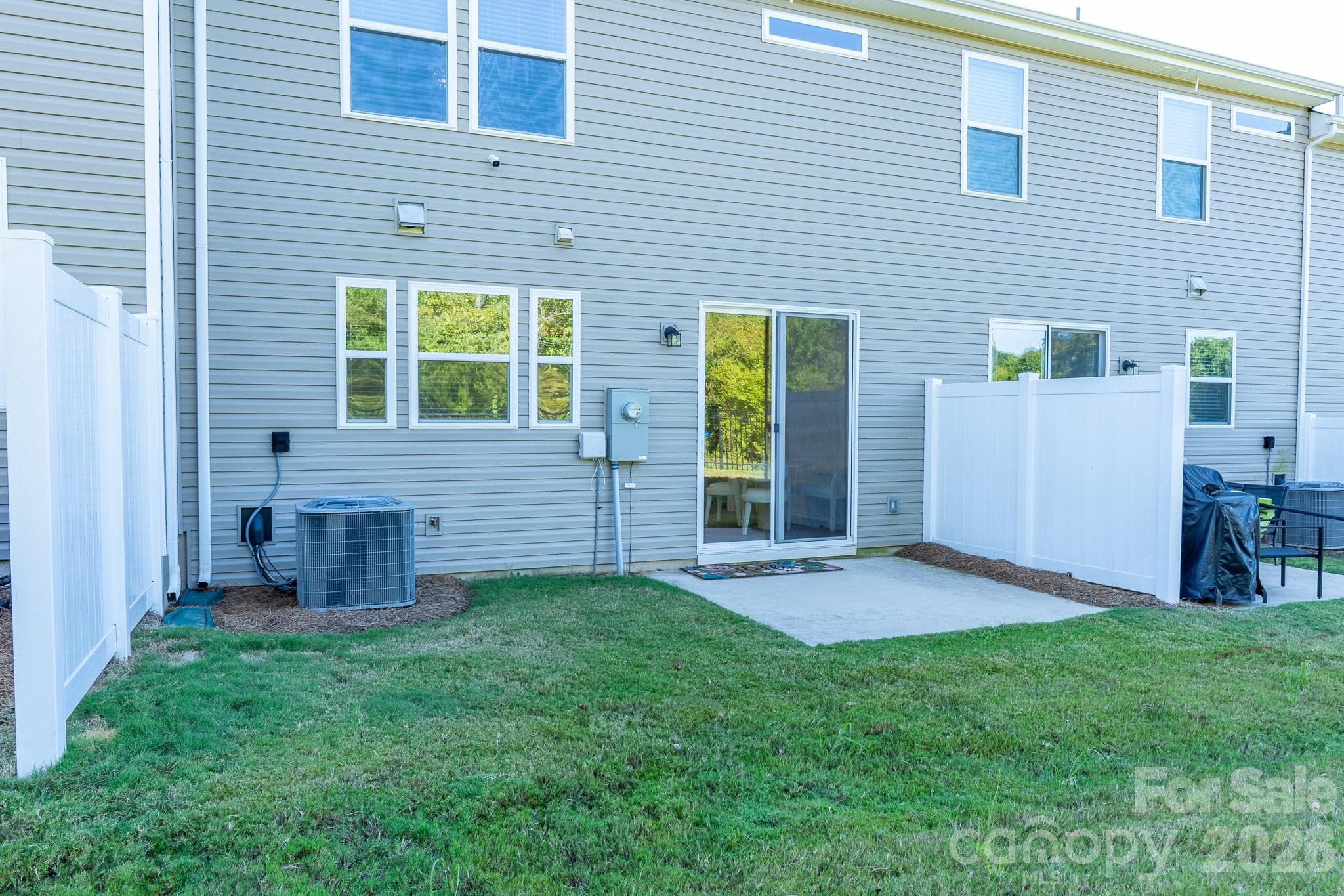 Privacy fence on both sides of patio overlooking wooded area - 9238 Northfield Crossing Drive, Charlotte