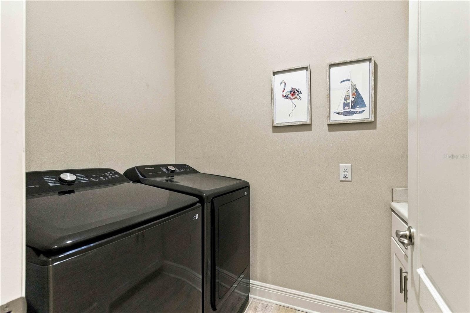 Laundry room with ample storage - 15502 31ST ST E, PARRISH