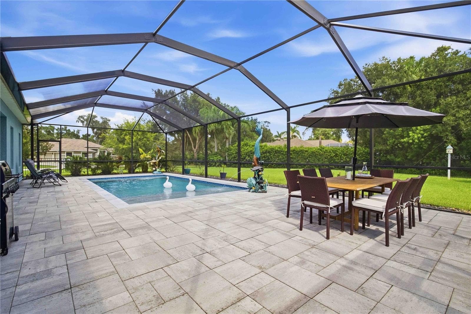 Outdoor dining overlooking the pool - 15502 31ST ST E, PARRISH