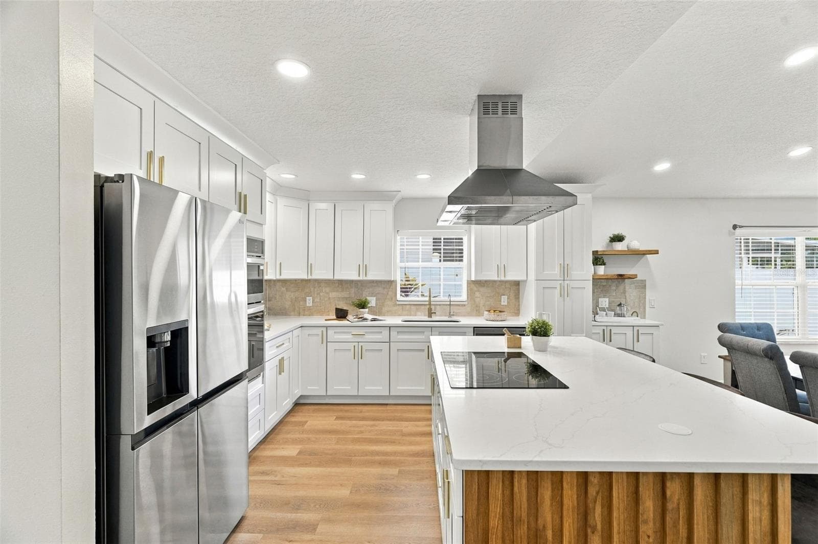 A generous center island with built-in outlets add ease for everyday living. - 625 FOLSOM ST S, ST PETERSBURG
