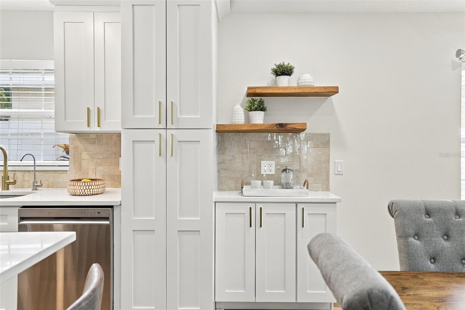 Extra pantry storage and a coffee bar with floating shelves. Every detail has been taken care of! - 625 FOLSOM ST S, ST PETERSBURG