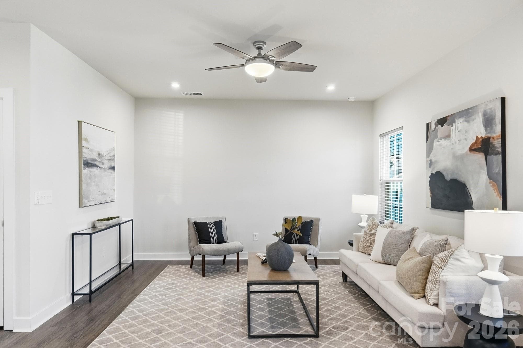 Spacious, light-filled living area with an open floor plan. - 1857 Giana Lane, Monroe