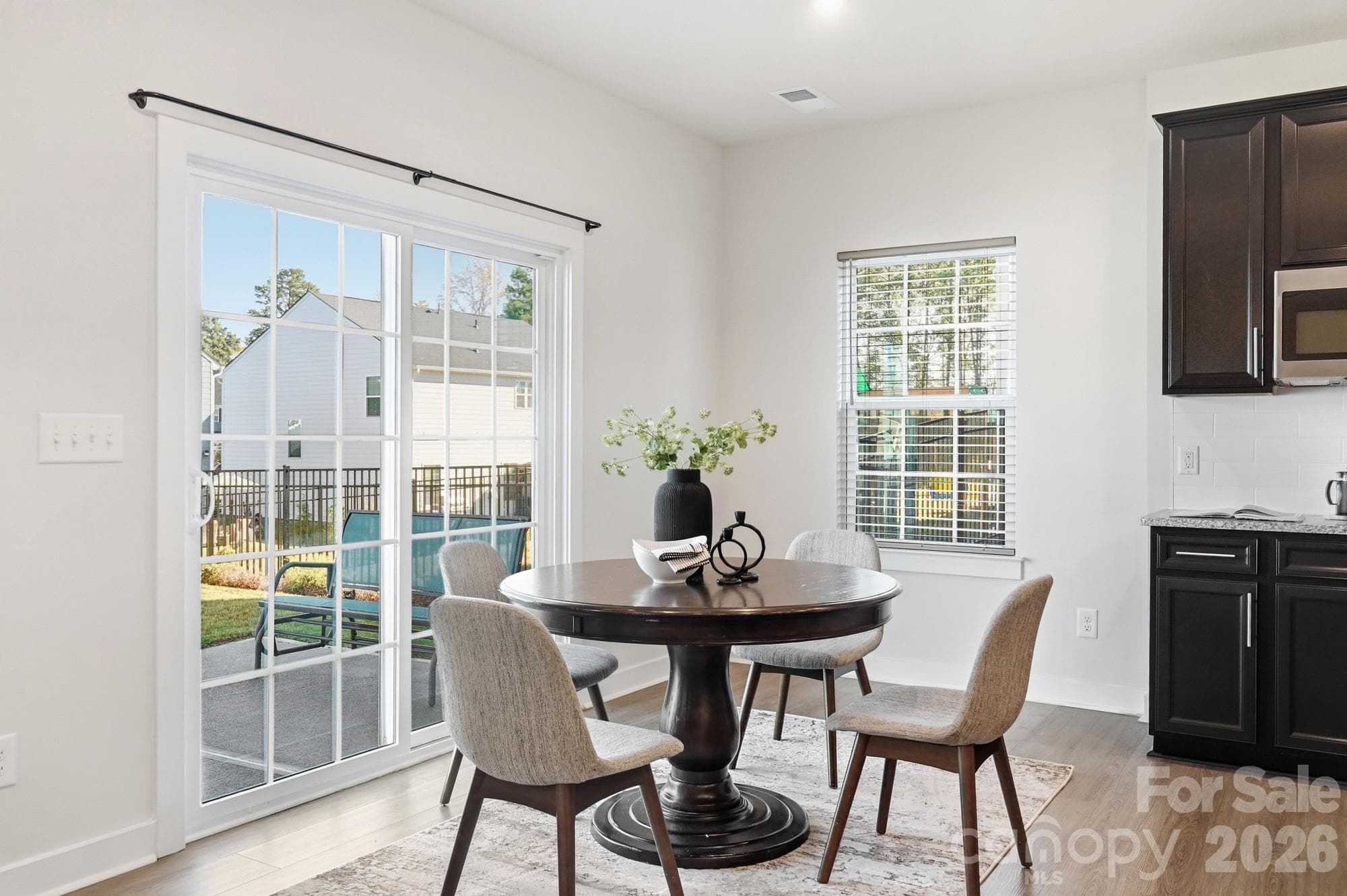 Spacious dining area with elegant finishes and natural lighting. - 1857 Giana Lane, Monroe