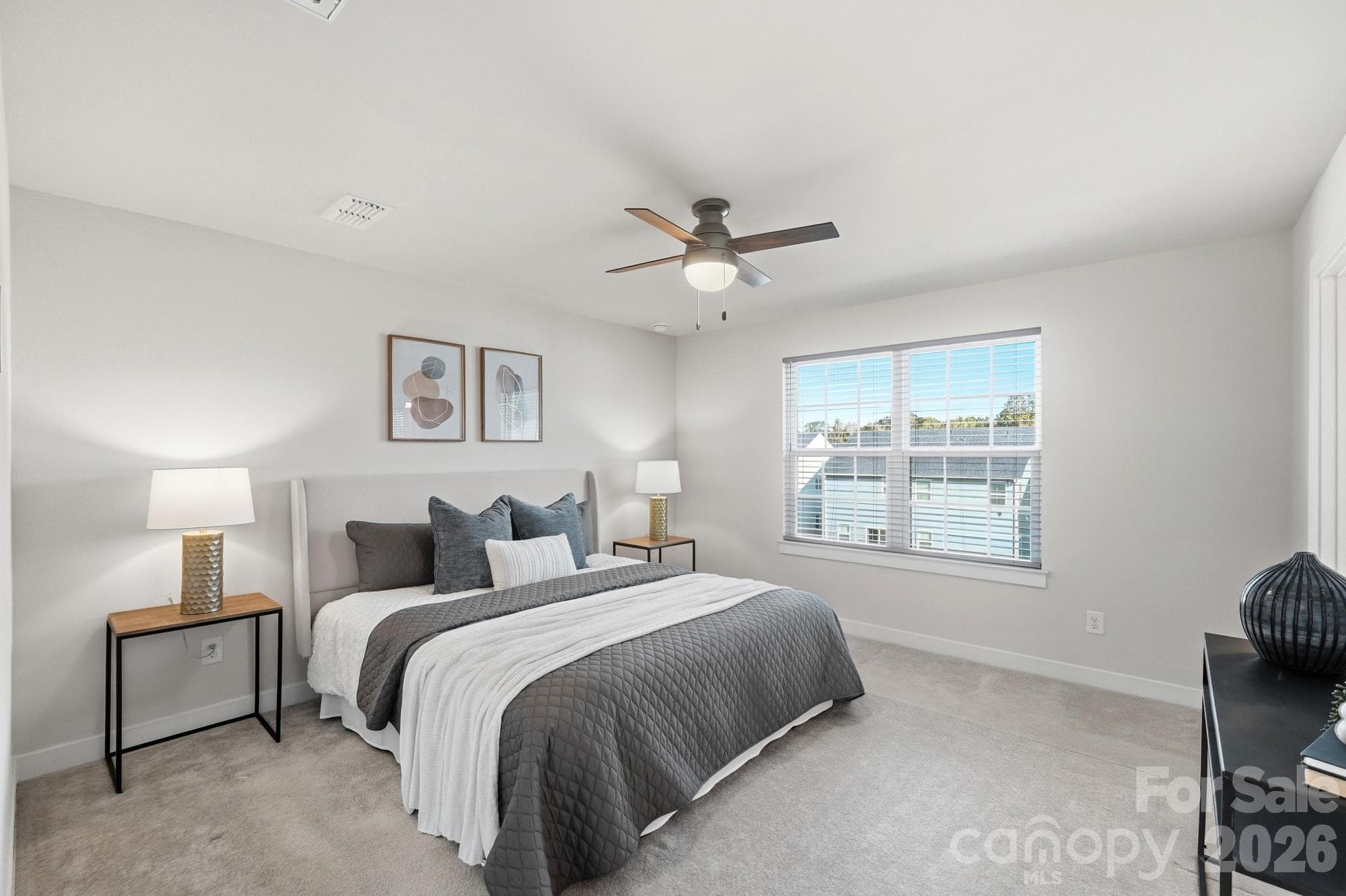 Spacious primary bedroom with ample natural light. - 1857 Giana Lane, Monroe