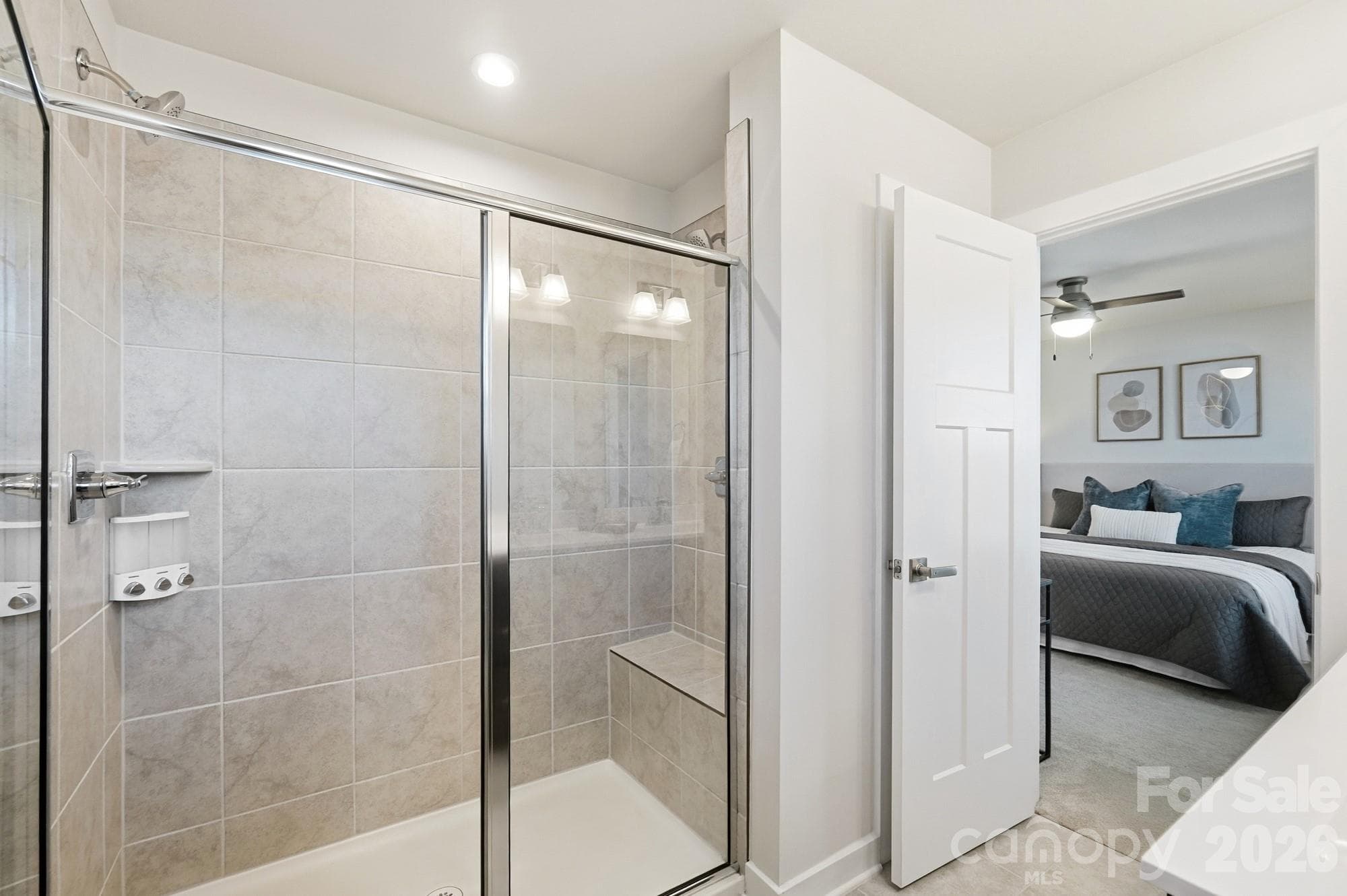 Roman style shower with dual shower heads and sitting bench - 1857 Giana Lane, Monroe