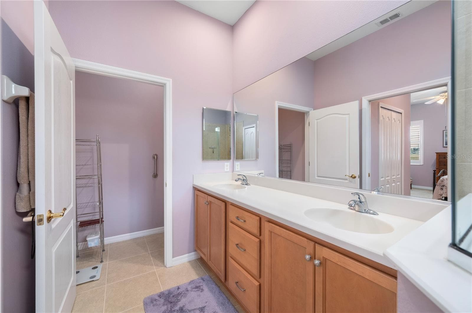 Ensuite bath has pass-through linen closet - 24024 BUCKINGHAM WAY, PORT CHARLOTTE