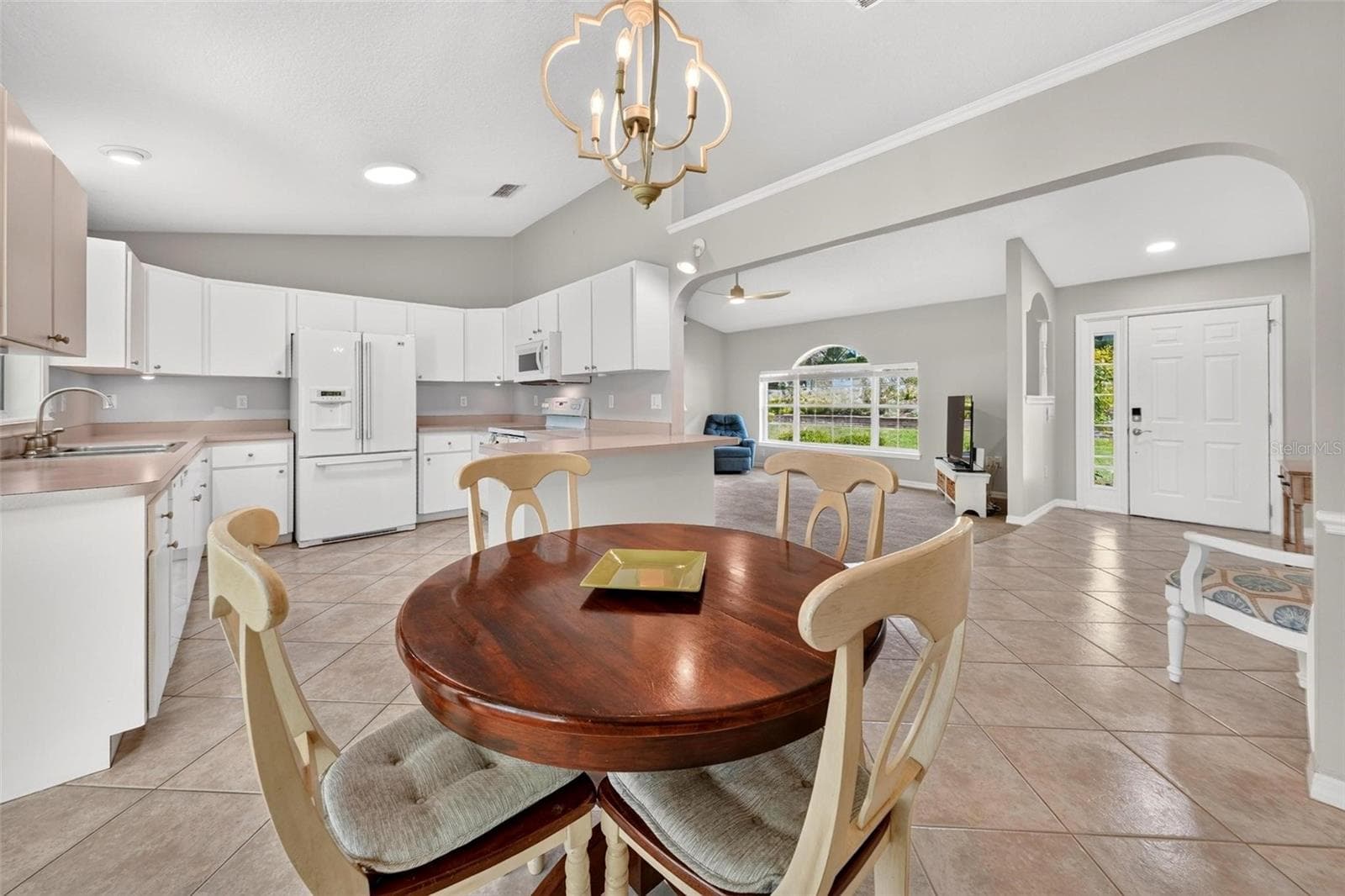 Dining room towards front entry - 211 HANGING MOSS LN, LADY LAKE