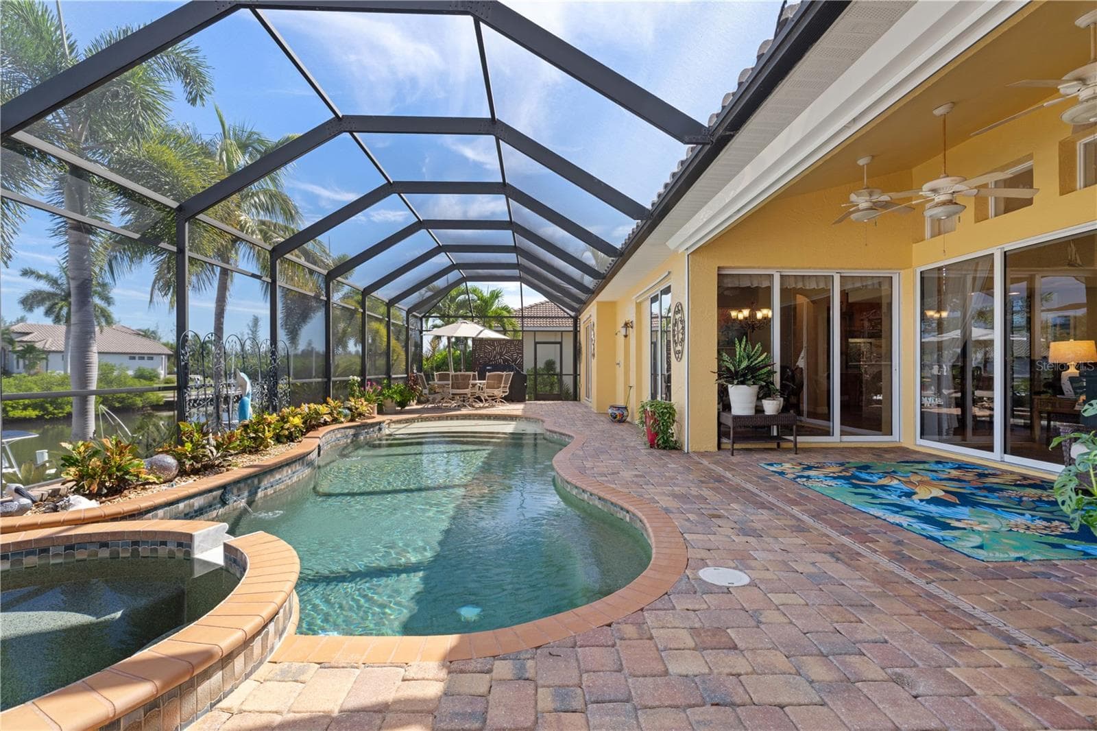 Outdoor oasis with in-ground, heated pool and attached spa - 1448 KIWI CT, PUNTA GORDA