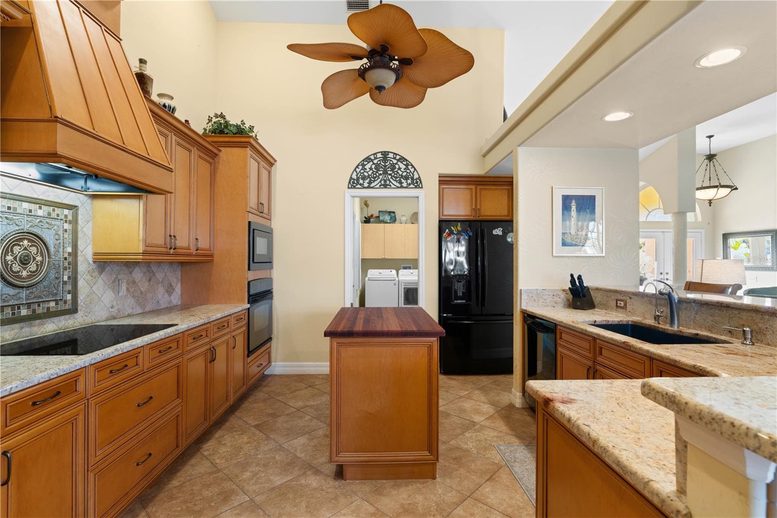 Gourmet kitchen with granite counters, center island and ample cabinetry - 1448 KIWI CT, PUNTA GORDA