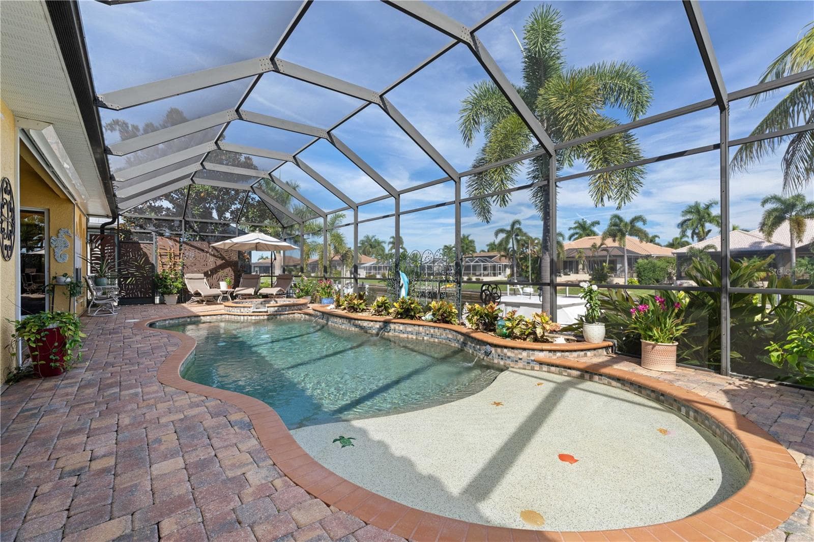 Tanning/sun shelf connected to in-ground, heated pool - 1448 KIWI CT, PUNTA GORDA