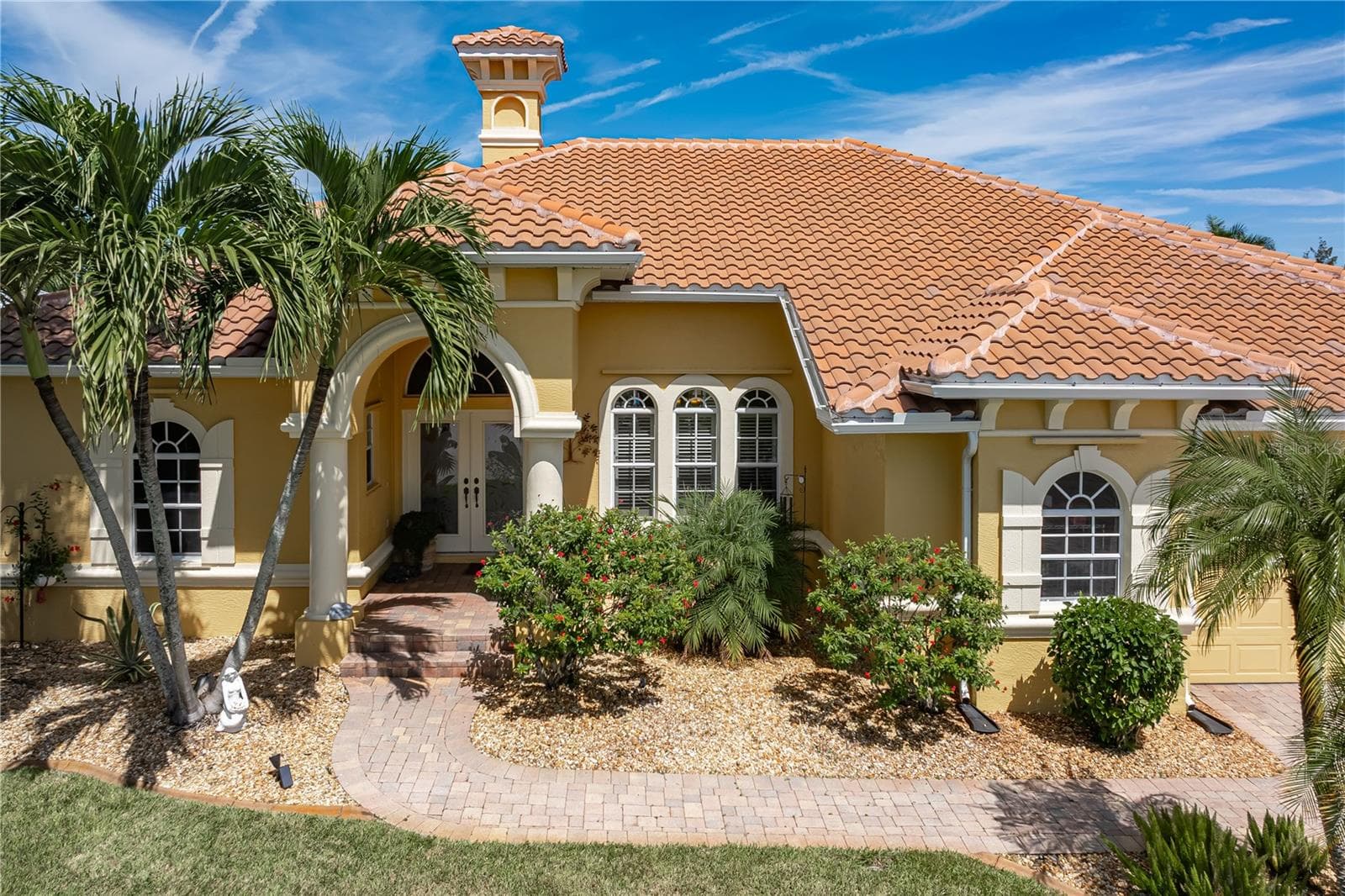 Well-maintained landscaping and brick paver walkway - 1448 KIWI CT, PUNTA GORDA