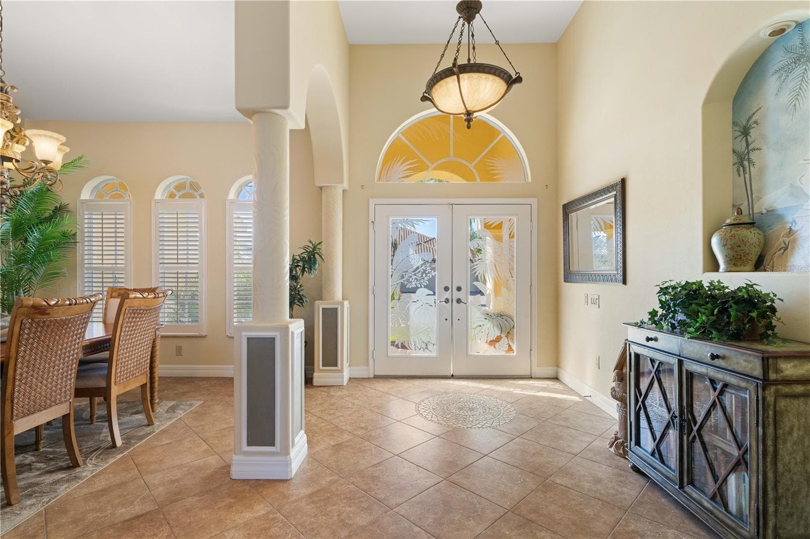 Foyer with columns. Arched transom window above front door. - 1448 KIWI CT, PUNTA GORDA