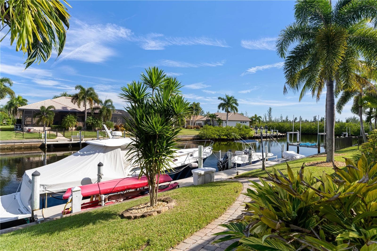 Brick paver walkway leads to private dock - 1448 KIWI CT, PUNTA GORDA