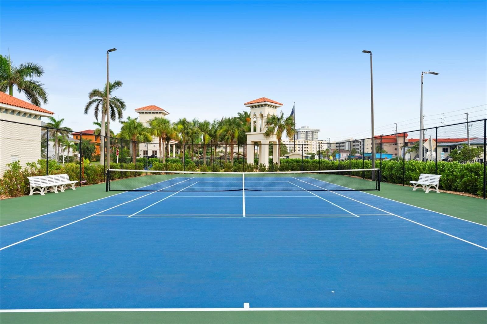 Ground view of our gorgeous tennis courts, fully lit up at night and secured - 17717 GULF BLVD #604, REDINGTON SHORES
