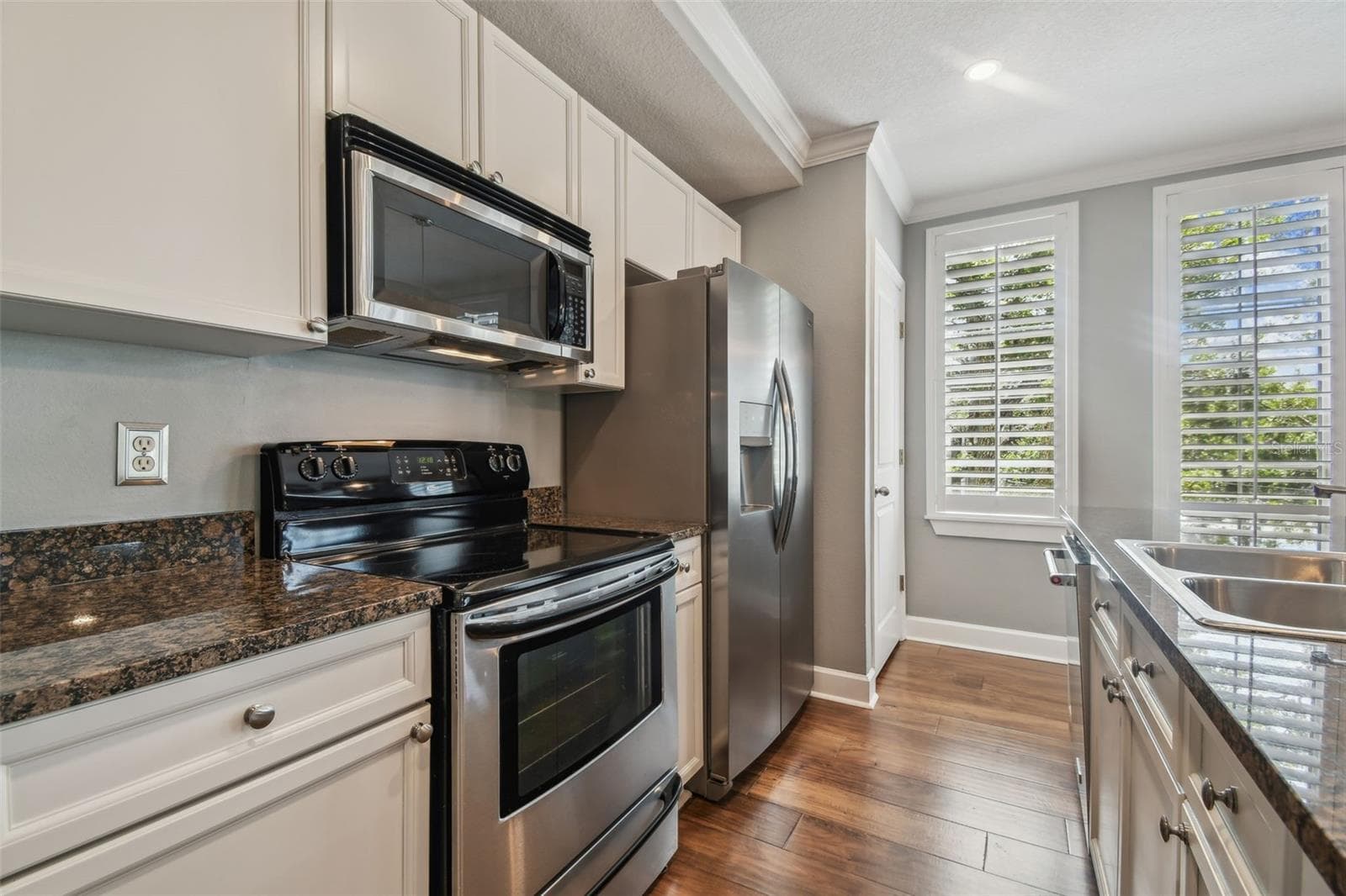 Kitchen featuring stainless steel appliances, and stone countertops. - 435 S OREGON AVE #304, TAMPA