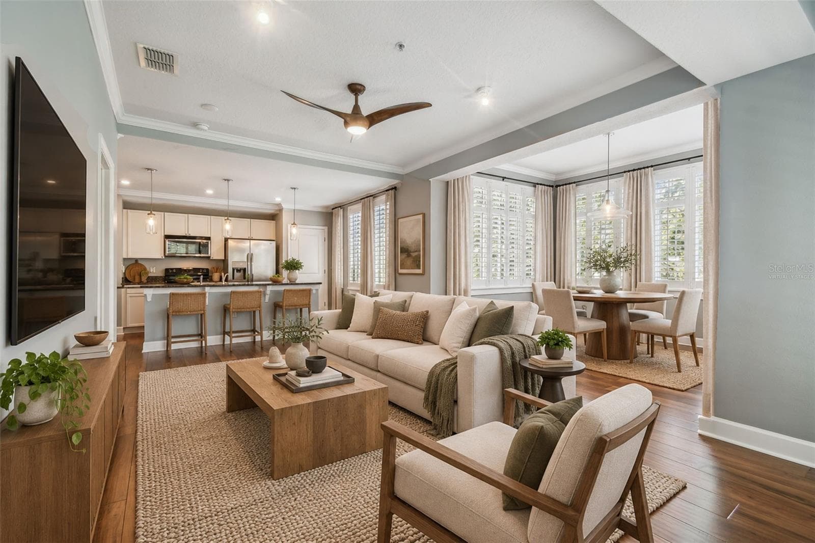 Virtually staged photos of living/dining combo with an abundance of natural light. - 435 S OREGON AVE #304, TAMPA