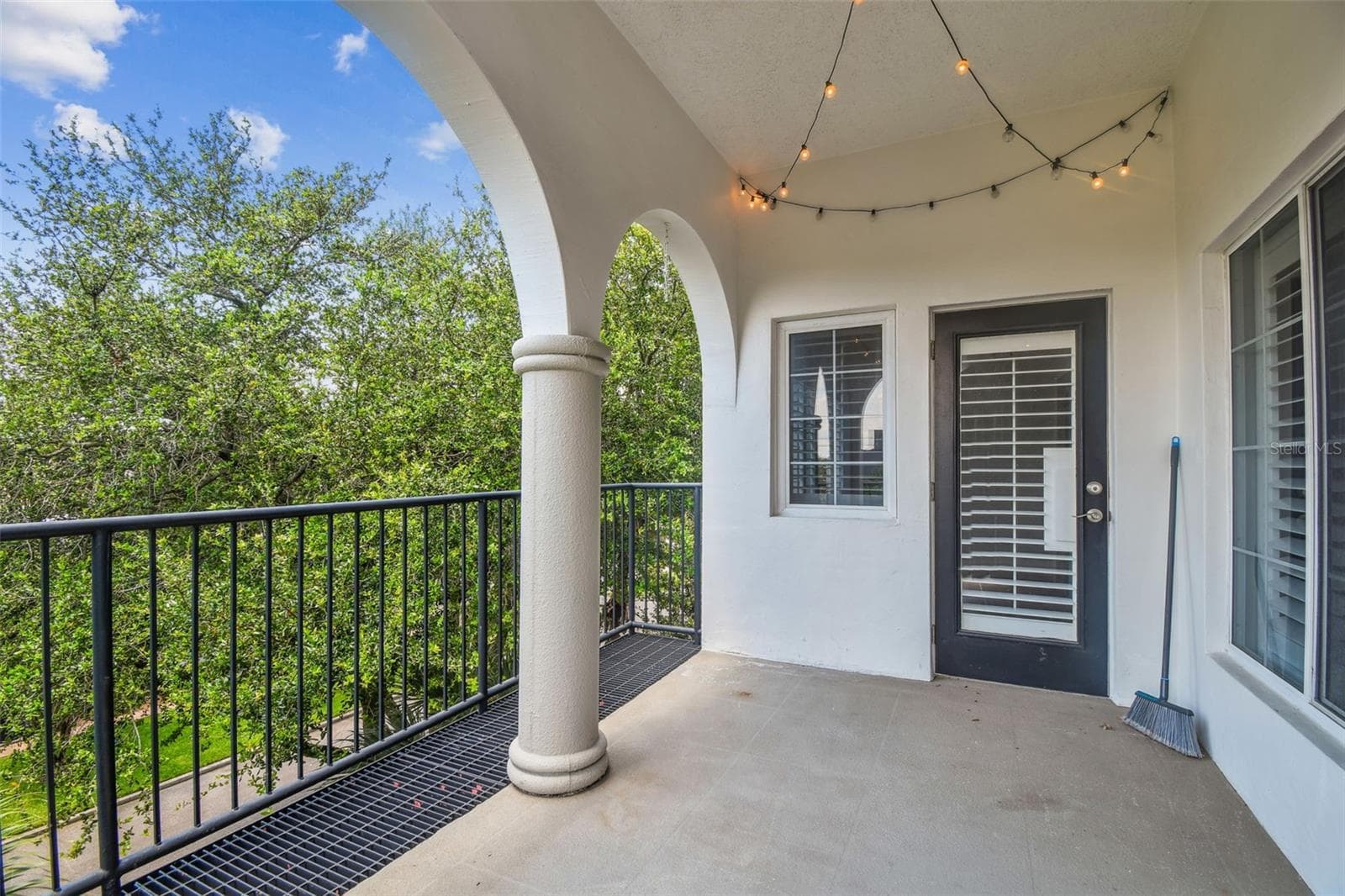 Enclosed outdoor patio overlooking tree-lined street. - 435 S OREGON AVE #304, TAMPA