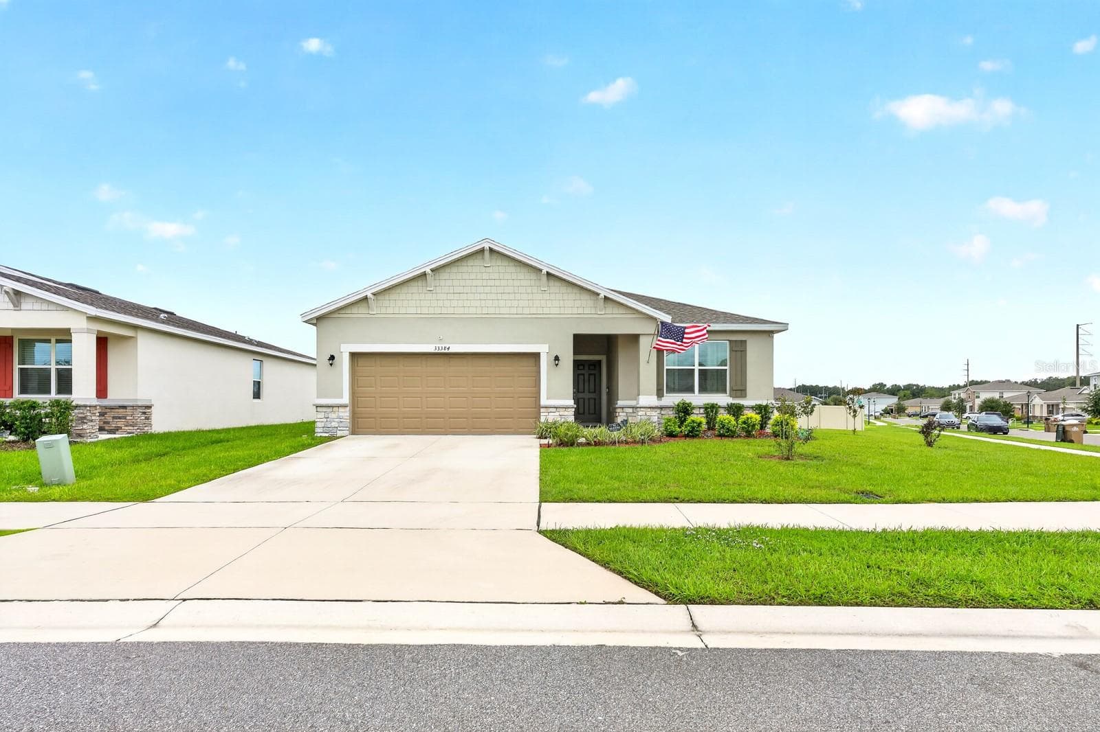 From the curb, the home makes a great first impression with STONE FACING AND SHAKER SHINGLES adding character to the front elevation. - 33384 COUNTRY HOUSE DR, SORRENTO