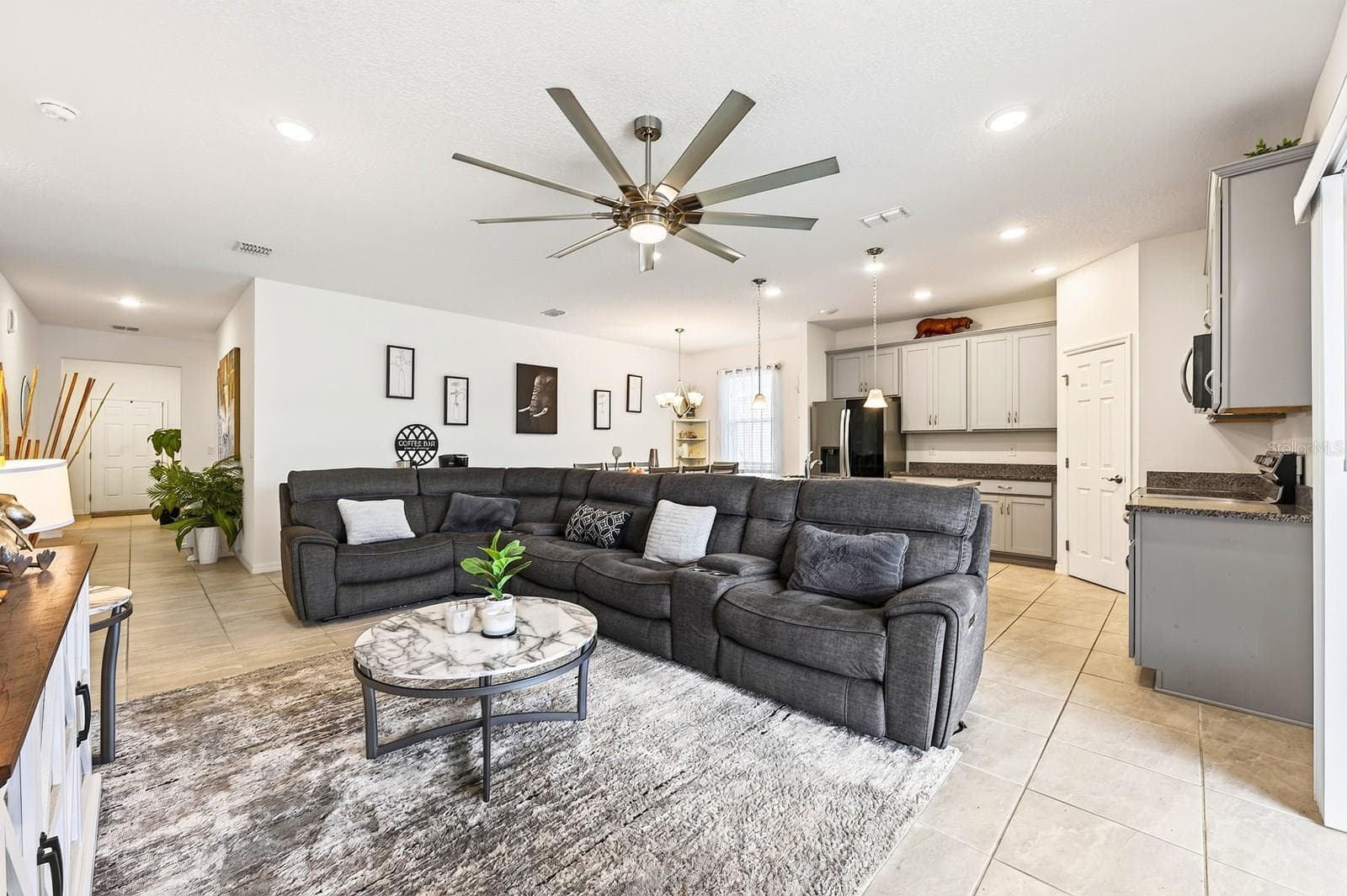 Inside, the OPEN FLOOR PLAN allows the Living Room, Dining Area and Kitchen to flow seamlessly together, creating a bright and inviting space for everyday living and entertaining. - 33384 COUNTRY HOUSE DR, SORRENTO