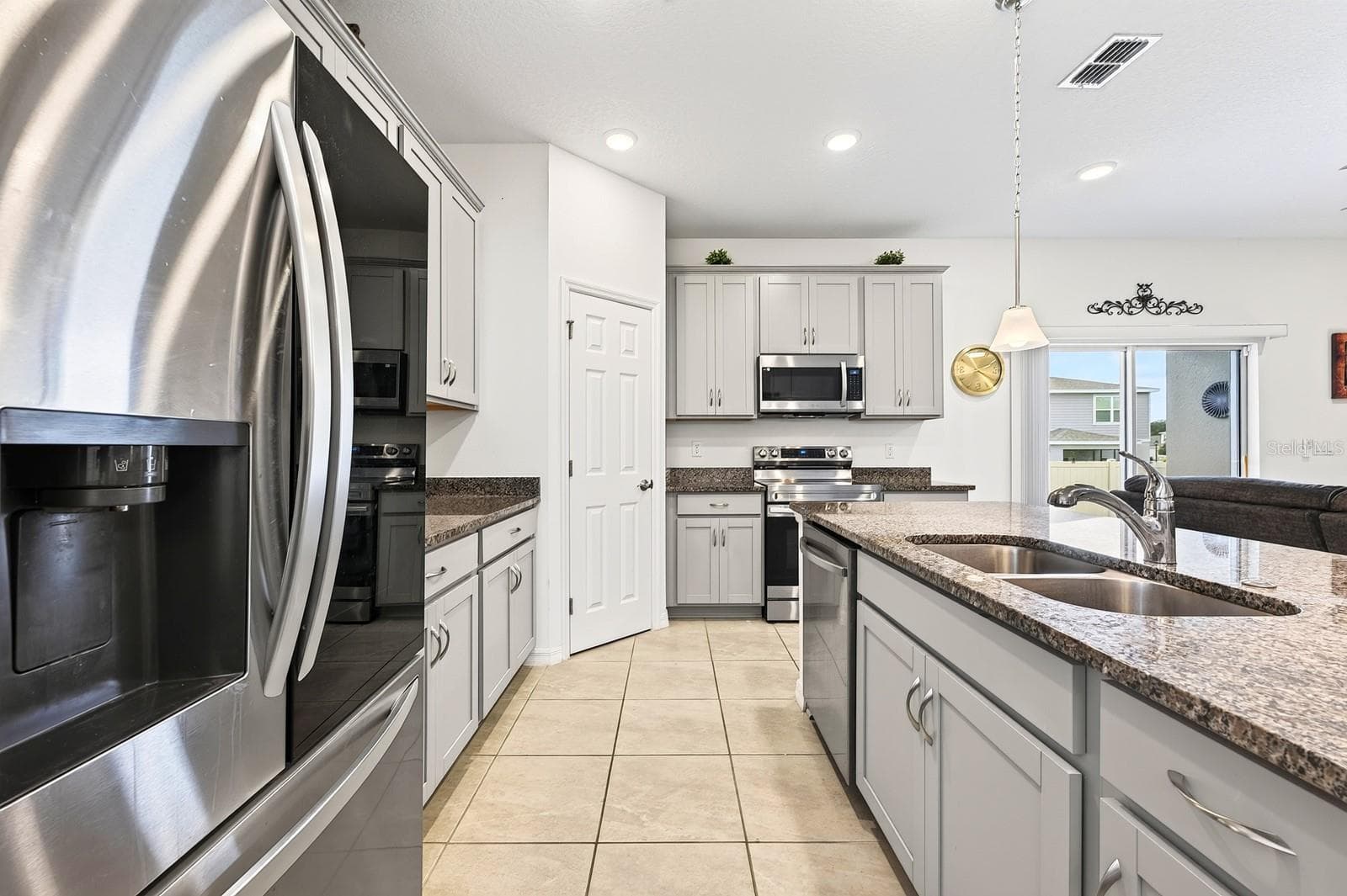 The open-concept Kitchen anchors the home with a functional layout. - 33384 COUNTRY HOUSE DR, SORRENTO