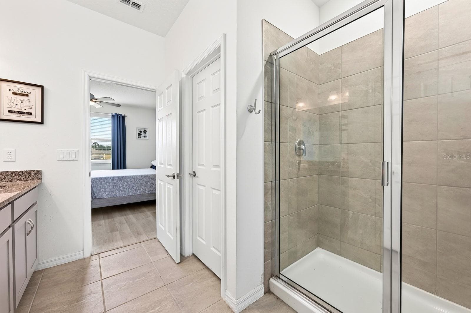 The Primary en-suite bath boasts dual sinks, a step-in shower, private water closet, linen closet and LARGE WALK-IN CLOSET. - 33384 COUNTRY HOUSE DR, SORRENTO