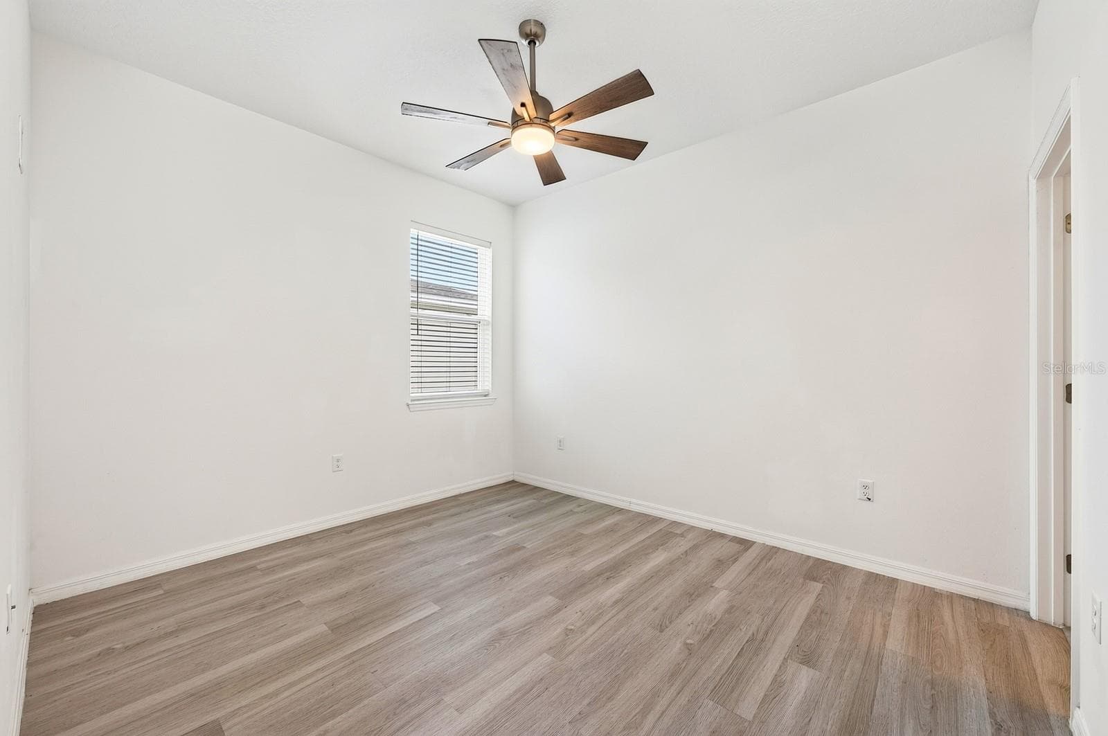 The fourth Bedroom is tucked near the garage entrance and features its own PRIVATE EN-SUITE BATH, making it an ideal GUEST SUITE, MULTIGENERATIONAL SPACE or HOME OFFICE. - 33384 COUNTRY HOUSE DR, SORRENTO