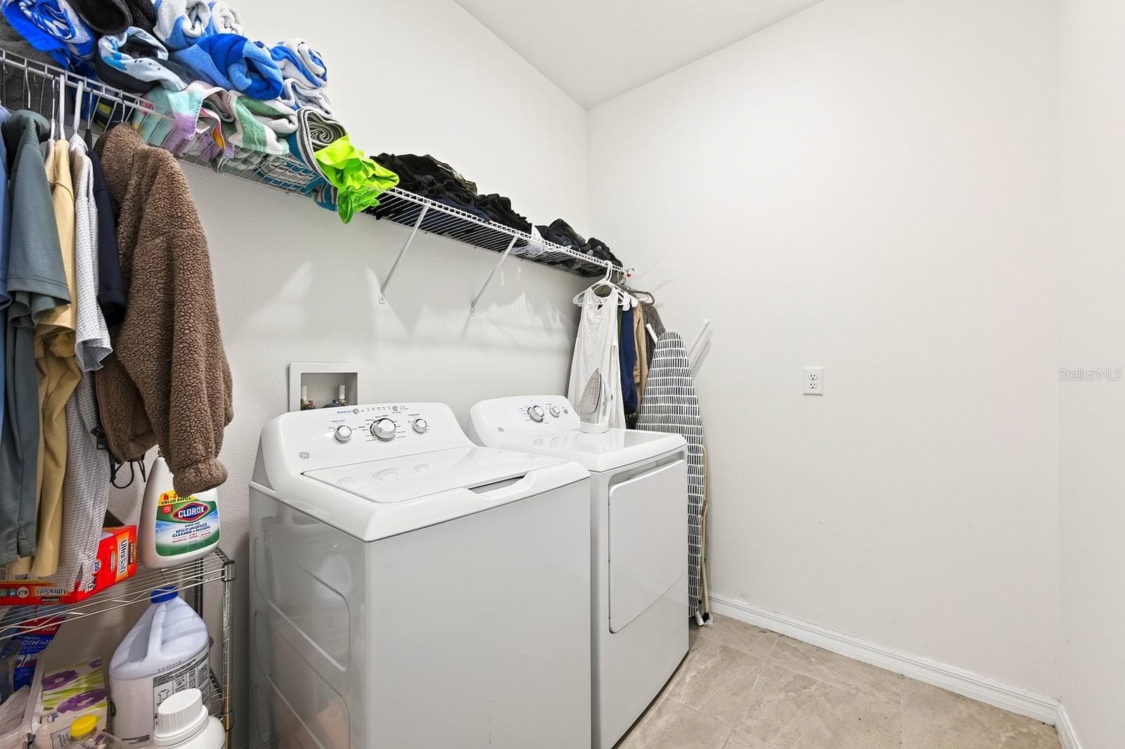 A convenient Laundry Room has shelving to help keep supplies handy. - 33384 COUNTRY HOUSE DR, SORRENTO
