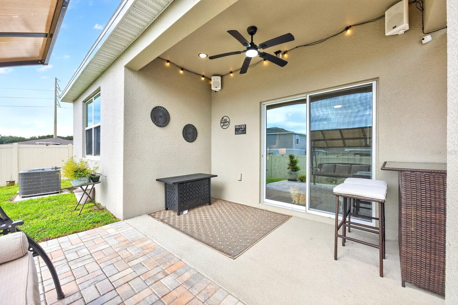 Step through the Living Room's sliding glass doors and discover an outdoor space designed for enjoying the Florida lifestyle. - 33384 COUNTRY HOUSE DR, SORRENTO