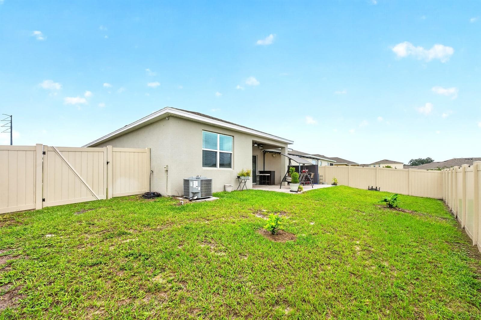 The generous backyard offers endless possibilities for entertaining and enjoying the outdoors. - 33384 COUNTRY HOUSE DR, SORRENTO